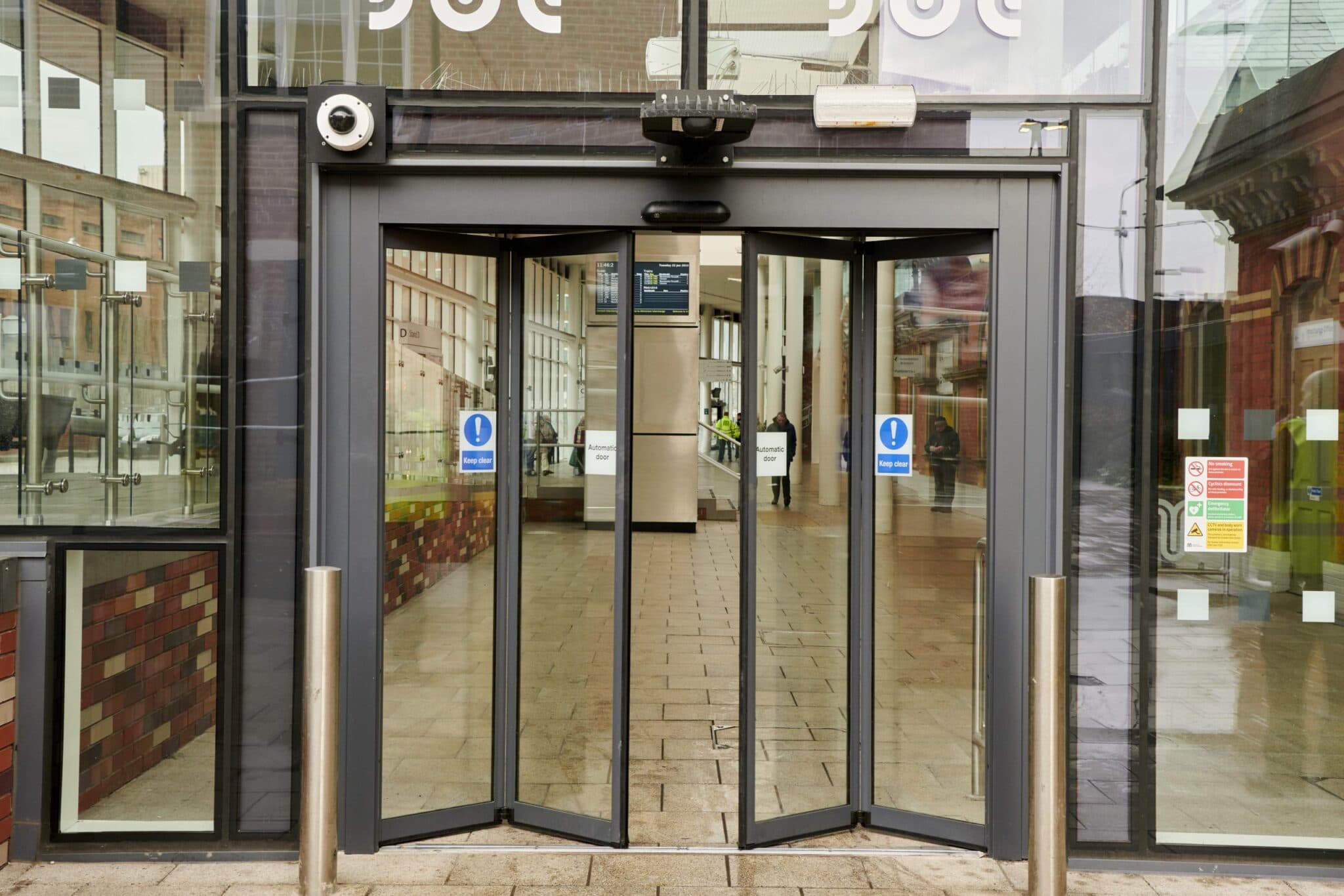 Automatic folding door open at a commercial entrance